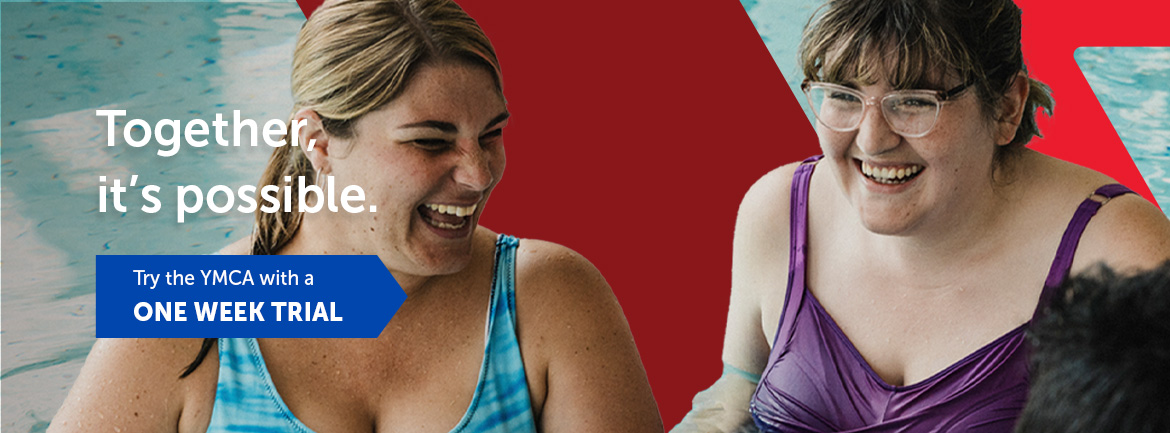 Two YMCA members enjoying an aquatic program, smiling and interacting in the pool.